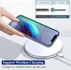 A hand is placing a smartphone with a blue case onto a white wireless charging pad. Produktbild-Vorschau