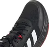 A close-up view of the toe area of a black Adidas sneaker with white stripes and red accents. Podgląd zdjęcia produktu