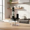 A kitchen counter with a blender attachment and container. Produktbild-Vorschau