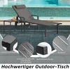 A lounge chair and small table next to a swimming pool. Náhled obrázku produktu