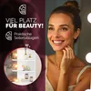 A woman is smiling while looking in a mirror with lights, and a corner shelf unit with decorative items is shown in a circular inset. Produktbild-Vorschau