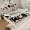 A bedroom scene with a bed featuring storage, a nightstand, and artwork on the wall. Náhled obrázku produktu