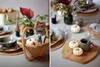 A table setting with decorative pumpkins and a basket. Podgląd zdjęcia produktu