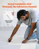 A man is kneeling on the floor, assembling interlocking mats. Podgląd zdjęcia produktu