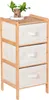 A three-drawer bamboo dresser with a small plant on top. Podgląd zdjęcia produktu