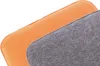 Close-up view of two fabric cushions, one orange and one gray, layered on top of each other. Produktbild-Vorschau