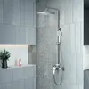 A modern bathroom with a silver shower system in use. Náhled obrázku produktu
