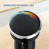 A close-up of a black kitchen hand blender with a circular LED display showing speed indicators and the word 'Turbo'. The background shows a kitchen counter and cabinets. Produktbild-Vorschau