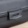 Close-up of a black lunchbox latch. Náhľad obrázku produktu