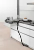 A kitchen counter with a built-in vacuum cleaner drawer and a bowl of food. Podgląd zdjęcia produktu
