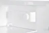 Interior view of a refrigerator with a temperature control knob. Produktbild-Vorschau