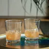 Two glasses of beverage with ice cubes on a decorative tray. Náhľad obrázku produktu