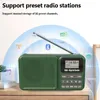 A green portable radio is displayed on a wooden surface, with graphic elements suggesting radio waves and connectivity. Produktbild-Vorschau