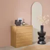 A wooden dresser with decorative items on top, placed against a pink wall with an arched mirror in the background. Anteprima dell’immagine prodotto