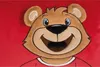 Close-up of a stuffed bear's face on a red background. Náhľad obrázku produktu