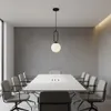 A modern conference room with a long white table and chairs, illuminated by a pendant light. Náhled obrázku produktu