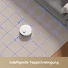 A white robot vacuum cleaner is shown cleaning a carpeted floor with a blue grid overlay indicating its cleaning path. A portion of a sofa is visible in the background. Produktbild-Vorschau