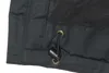 A close-up view of a dark blue jacket's drawstring and grommets. Produktbild-Vorschau
