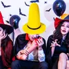 People in Halloween costumes with spooky decorations. Produktbild-Vorschau