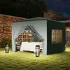 A garden pavilion set up with a table and chairs, illuminated by outdoor lanterns at night. Podgląd zdjęcia produktu