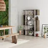 A modern living room with a bookshelf, dining table, and a green wall. Produktbild-Vorschau