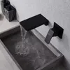 A modern bathroom sink with a black wall-mounted faucet. Náhled obrázku produktu