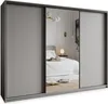 A modern sliding door wardrobe with a mirrored center panel, reflecting a bedroom interior. Produktbild-Vorschau