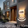 A modern house exterior at dusk with a lit house number sign. Náhľad obrázku produktu
