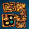 Several game boards are arranged on a blue background. Produktbild-Vorschau
