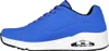 A side view of a blue sneaker with a white sole. Voir les images du produit