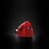 A red cordless hand blender with a charging base is shown against a black background. Podgląd zdjęcia produktu