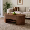 A living room scene with a couch, coffee table, and plant. Produktbild-Vorschau