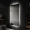 A modern hallway with a large, illuminated mirror. Produktbild-Vorschau