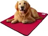 A golden retriever dog lying on a red pet mat. Produktbild-Vorschau