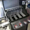 Close-up view of the interior of a Weber Spirit 300 series gas grill. Podgląd zdjęcia produktu