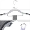 Collage showing different angles and features of plastic hangers, including a close-up of the non-slip design and a hanger holding a camisole. Náhled obrázku produktu