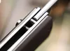 A close-up, angled view of the locking mechanism of a folding knife. Náhled obrázku produktu