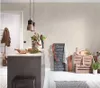 A kitchen island with a chalkboard menu, wooden crates, and kitchen utensils. Produktbild-Vorschau