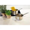 Two stainless steel saucepans are on a white countertop, with two potted herbs to the left. One saucepan contains spaghetti. Náhľad obrázku produktu