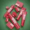 A collection of red hair styling products from the OSIS+ brand are arranged on a green background. Podgląd zdjęcia produktu