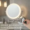 A bathroom vanity with a lighted makeup mirror. Produktbild-Vorschau