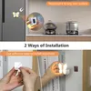 Collage showing two ways to install a butterfly-shaped LED night light: magnetically on a refrigerator and with adhesive tape on a bookshelf. Produktbild-Vorschau