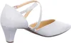A side view of a single silver glitter shoe with a low heel and criss-cross straps. Voir les images du produit