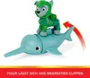 A toy dog figure riding on a toy sea creature. Anteprima dell’immagine prodotto