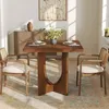 A dining set with a wooden table and two chairs in a room with a sideboard and artwork. Voir les images du produit