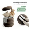 A collage of images showing a brown storage ottoman, a teddy bear, a pillow, a blanket, and a person's legs resting on a similar ottoman. Produktbild-Vorschau