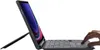 A hand is shown using the touchpad of a tablet with a keyboard case. Produktbild-Vorschau