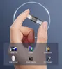A hand holding a USB data blocker with icons of compatible devices below. Produktbild-Vorschau