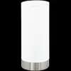A cylindrical table lamp with a white frosted glass shade and a brushed metal base, isolated on a black background. Náhľad obrázku produktu