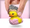 A hand holding a Glinda the Good Witch rubber duck toy. Náhled obrázku produktu